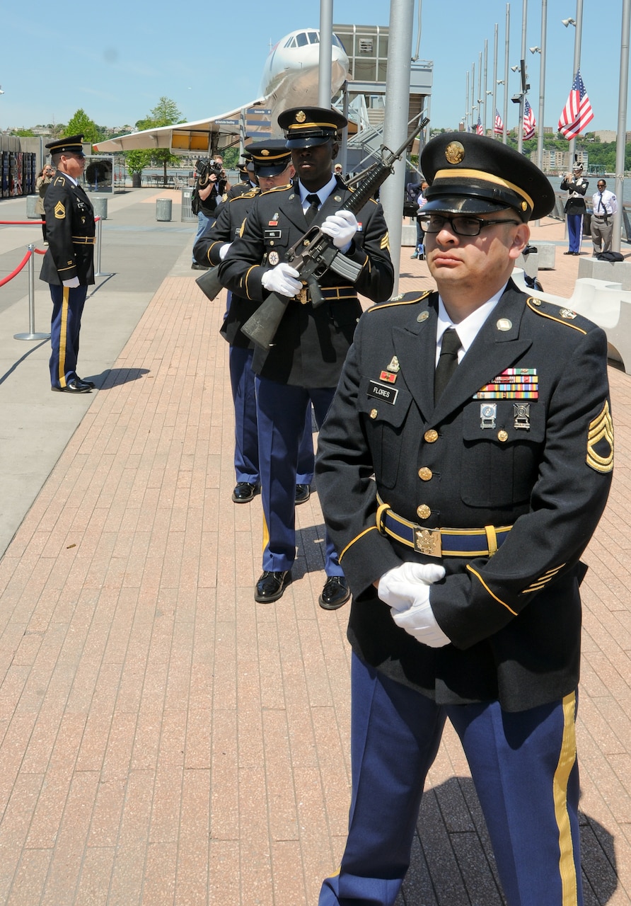 Army Sgt. 1st Class Jose Flores leads the rifle team from the Army Reserve’s 99th Regional Support Command during the Memorial Day commemoration at the Intrepid Sea, Air and Space Museum in New York, May 27, 2013. Volunteering to go the extra mile in his military career is something Flores credits to his background as a Hispanic-American and combat-arms soldier. U.S. Army photo by Staff Sgt. Shawn Morris