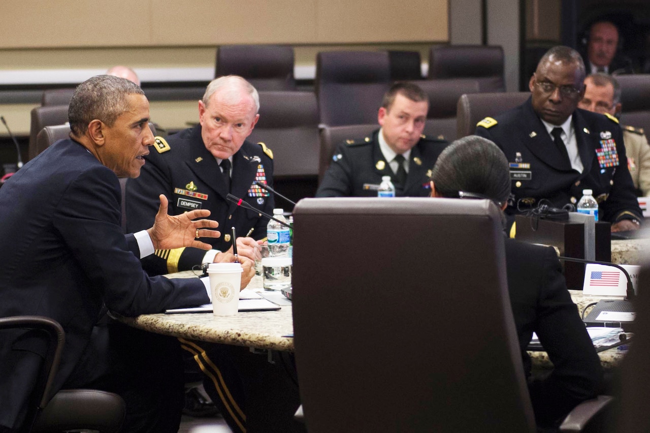 President Barack Obama meets with U.S. military leaders and representatives from 21 foreign nations to discuss strategy employed against Islamic State of Iraq and the Levant terrorists during a conference at Joint Base Andrews, Md., Oct 14, 2014. DoD photo by D. Myles Cullen
