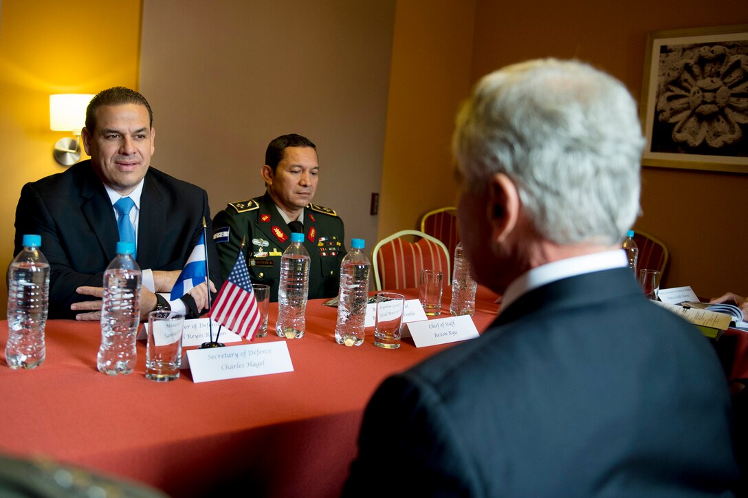 U.S. Defense Secretary Chuck Hagel meets with Honduran Defense Minister Samuel Reyes to discuss matters of mutual importance during the Conference of Defense Ministers of the Americas in Arequipa, Peru, Oct. 13, 2014.