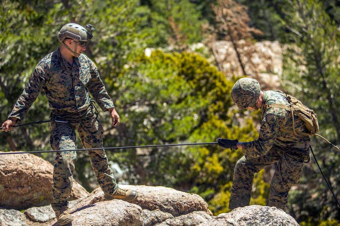 A Marine assault climber instructor discusses rappelling at Sardine ...