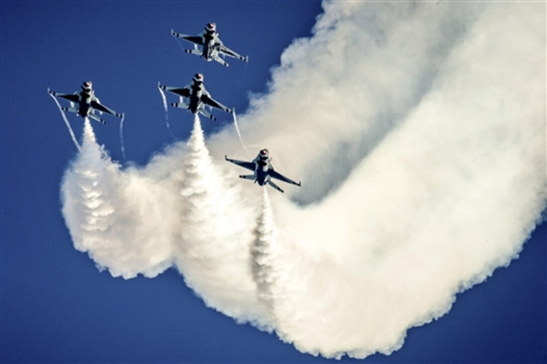 Pilots for the Thunderbirds, the Air Force's aerial demonstration team, perform an arrowhead loop during the Wings and Waves Air Show at Daytona Beach, Fla., Oct. 12, 2014.