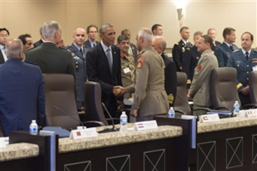 U.S. President Barack Obama meets with military leaders from 22 nations to discuss strategy in the Middle East during a conference at Joint Base Andrews, Md., Oct 14, 2014. The discussion was part of a ongoing effort to build a coalition and integrate capabilities.