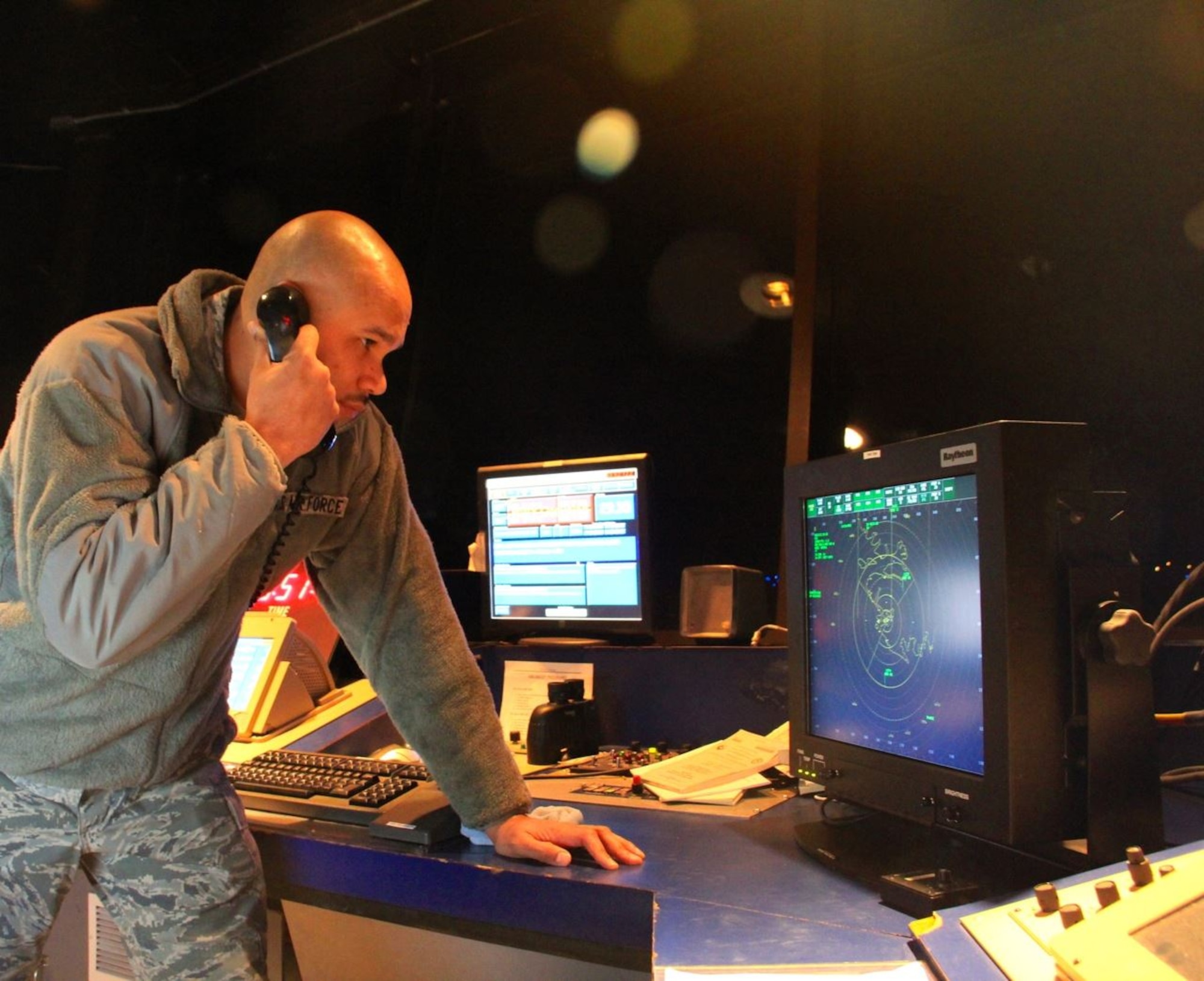 Tech. Sgt. Greylynn Carr, air traffic controller with the 821st Support Squadron, assists incoming aircraft while working Radar Approach Control at Thule AB Sept. 30. The aircraft carried cargo to resupply Canadian Forces Station Alert and Eureka Research Station to get them through the harsh winter. (U.S. Air Force photo/Tech. Sgt. Jason Brumbaugh)