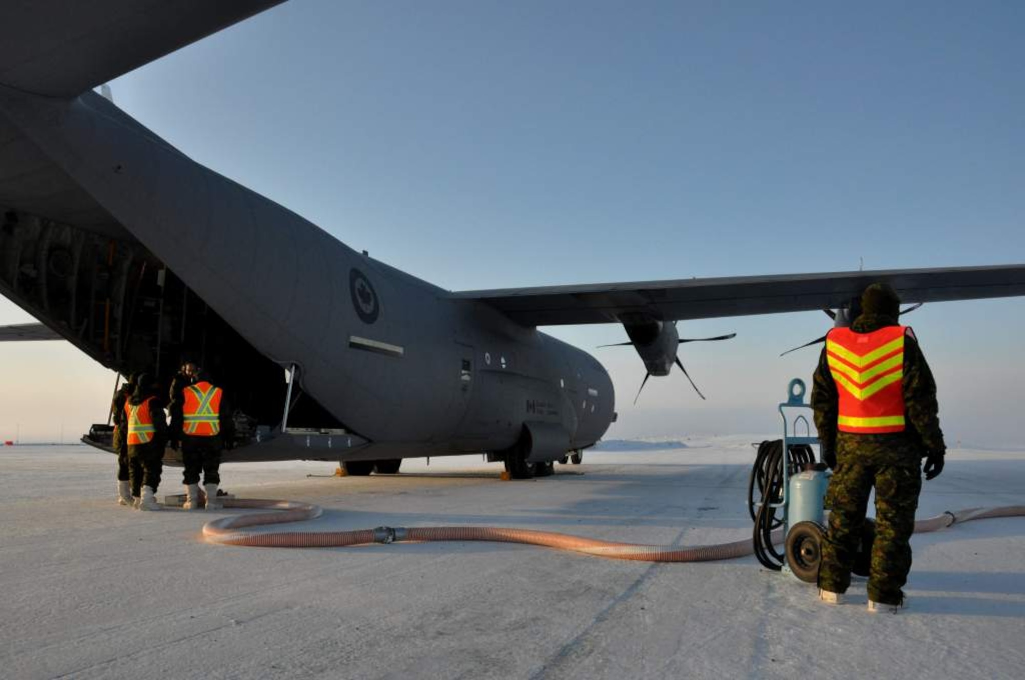Royal Canadian Air Force maintainers prepare to fill a fuel bladder inside a C-130 Globemaster III aircraft for delivery to Canadian Forces Station Alert Sept. 30. The resupply of CFS Alert was part of Operation Boxtop, a bi-annual mission to resupply Canadian outposts to assist them in sustaining the harsh Arctic winters. (U.S. Air Force photo/Tech. Sgt. Jason Brumbaugh)