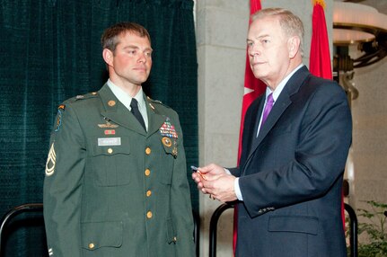 Ohio Gov. Ted Strickland awards the Silver Star Medal to Sgt. 1st Class Mark A. Wanner of Company B, 2nd Battalion, 19th Special Forces Group, during a Silver Star Medal award ceremony at the Ohio Statehouse Feb. 6, 2010. Wanner is the first Ohio National Guardmember to be awarded the Silver Star since the Korean War.