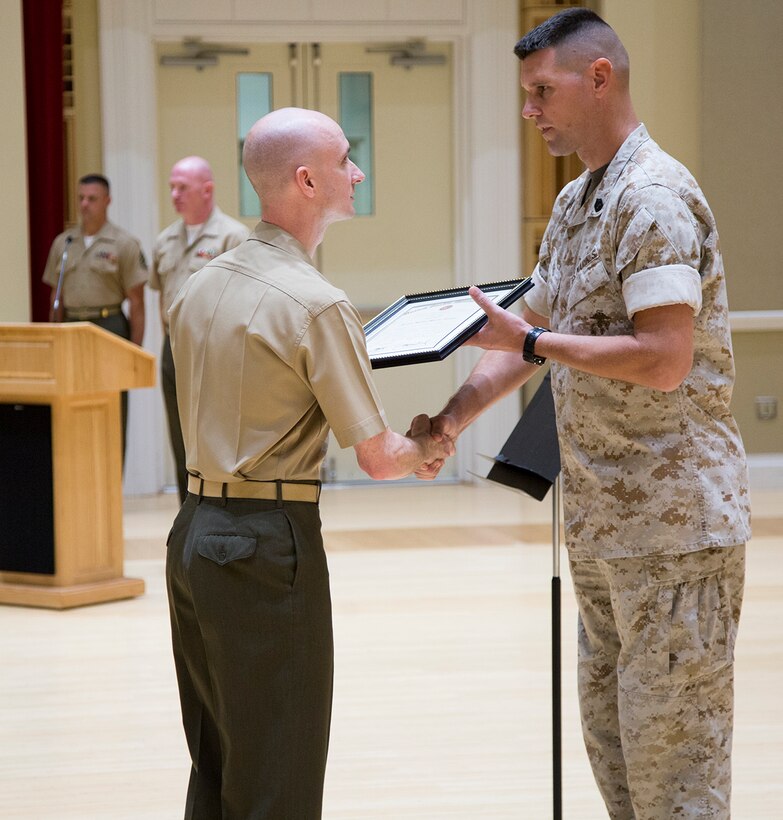 Marine Band Drum Major Duane F. King is promoted to Master Sergeant by Lt. Col. Jason K. Fettig during a ceremony in John Philip Sousa Band Hall. (U.S. Marine Corps photo by Staff Sgt. Brian Rust/released)