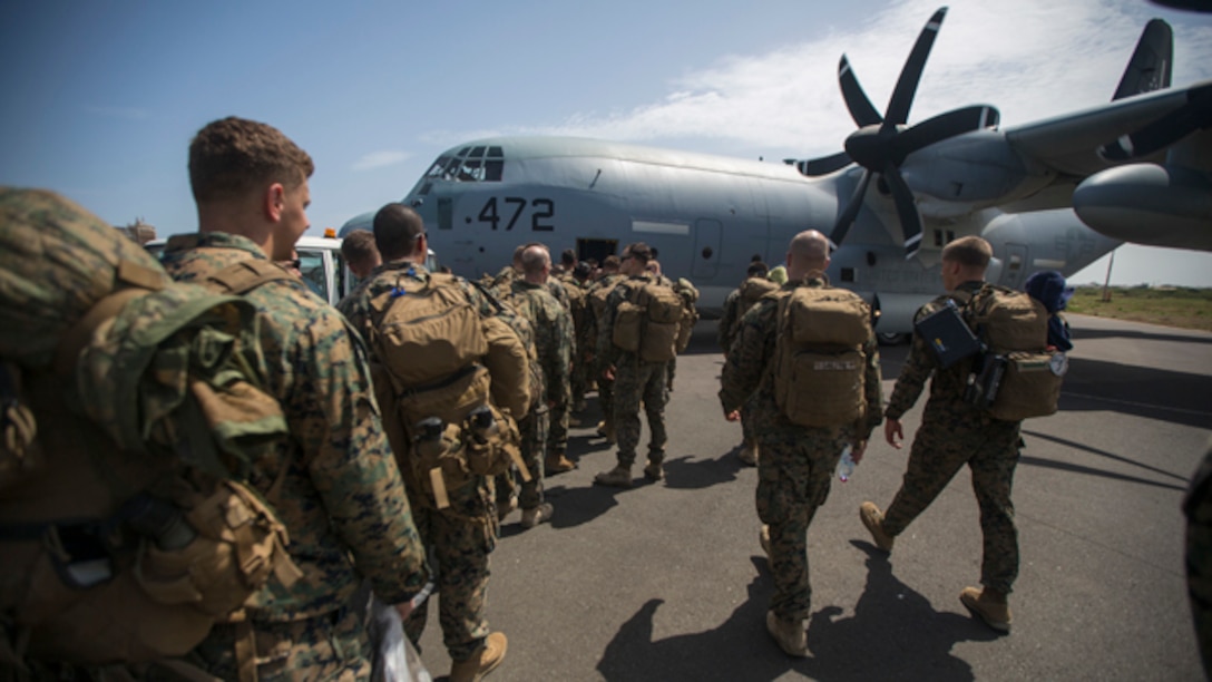 U.S. Marines and Sailors with Special-Purpose Marine Air-Ground Task Force - Crisis Response - Africa board a KC-130J Super Hercules to travel to Liberia from Dakar, Senegal, to support Operation United Assistance, Oct. 9, 2014. Operation United Assistance is part of a comprehensive U.S. Government effort, led by the U.S. Agency for International Development, to respond to and contain the outbreak of the Ebola virus in West Africa as quickly as possible. (U.S. Marine Corps photo by Lance Cpl. Andre Dakis/SPMAGTF Crisis Response - Africa Combat Camera/Released)