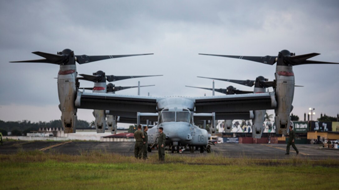 U.S. Marines with Special-Purpose Marine Air-Ground Task Force - Crisis Response - Africa conduct maintenance on MV-22B Ospreys in support of Operation United Assistance in Monrovia, Liberia, Oct. 10, 2014. Operation United Assistance is part of a comprehensive U.S. Government effort, led by the U.S. Agency for International Development, to respond to and contain the outbreak of the Ebola virus in West Africa as quickly as possible.