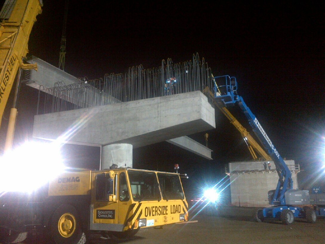 Placement of the first of 12 183-foot girders for the new Joint Base Lewis-McChord Connector Road began Oct. 14.  Girder installation is part of $7.4 million military construction project to connect JBLM's Fort Lewis with McChord Field.  The girders are being installed during the evenings October 14 and 15.