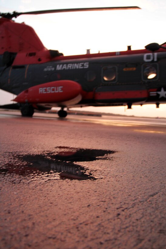 An HH-46E Sea Knight helicopter belonging to Marine Transport Squadron 1 sits on the Marine Corps Air Station Cherry Point, N.C., flight line as the sun rises Oct. 14, 2014. 
The Marines of VMR-1 specialize in land and sea search and rescue and transport of military personnel. VMR-1 is the only squadron in the Marine Corps whose primary mission is SAR and is the last remaining Marine Corps squadron to fly the Sea Knight.  
