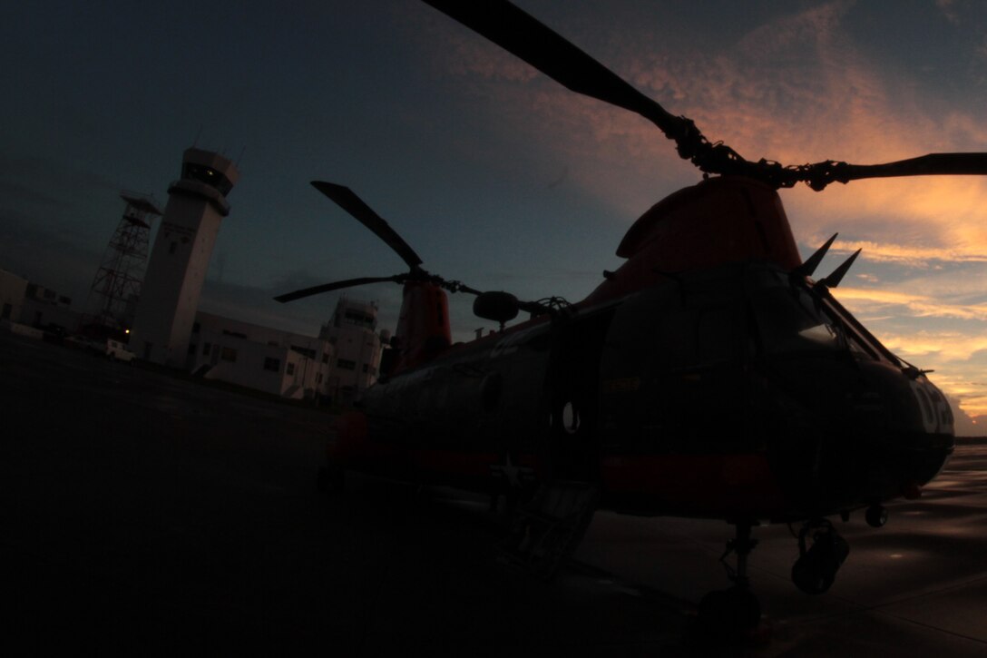An HH-46E Sea Knight helicopter belonging to Marine Transport Squadron 1 sits on the Marine Corps Air Station Cherry Point, N.C., flight line as the sun rises Oct. 14, 2014. 
The Marines of VMR-1 specialize in land and sea search and rescue and transport of military personnel. VMR-1 is the only squadron in the Marine Corps whose primary mission is SAR and is the last remaining Marine Corps squadron to fly the Sea Knight. 
