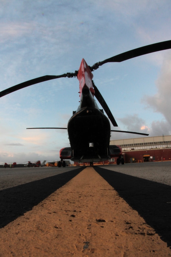 The tail end of an HH-46E Sea Knight helicopter sits open on the Marine Corps Air Station Cherry Point flight line as the sun rises Oct. 14, 2014. 
The Marines of VMR-1 specialize in land and sea search and rescue and transport of military personnel. VMR-1 is the only squadron in the Marine Corps whose primary mission is SAR and is the last remaining Marine Corps squadron to fly the Sea Knight.  
