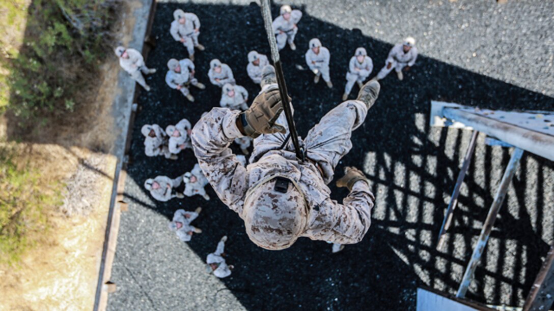 U.S. Marine Sgt. Andrew Shelly rappels from a tower during a helicopter rope-suspension techniques masters course aboard Camp Pendleton, Calif., Oct. 14, 2014. Shelly is a machine gunner with Battalion Landing Team, 3rd Battalion, 1st Marine Regiment, 15th Marine Expeditionary Unit.  BLT 3/1 is deploying this spring as the 15th MEU’s ground combat element. (U.S. Marine Corps photo by Cpl. Steve H. Lopez/Released)