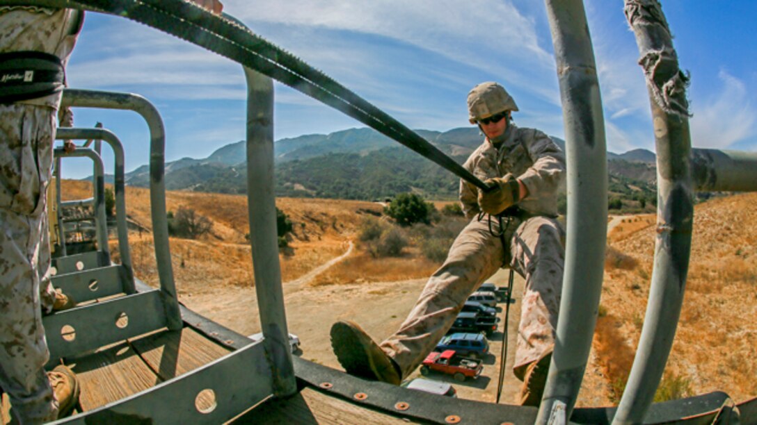 U.S. Marine Cpl. Even Whitney practices rappelling during a helicopter rope-suspension techniques masters course aboard Camp Pendleton, Calif., Oct. 14, 2014. Whitney is a machine gunner with Battalion Landing Team, 3rd Battalion, 1st Marine Regiment, 15th Marine Expeditionary Unit. BLT 3/1 is deploying this spring as the 15th MEU’s ground combat element. (U.S. Marine Corps photo by Sgt. Jamean Berry/Released)