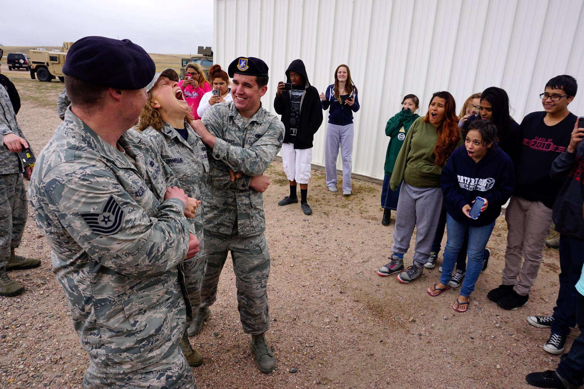 1st Lt. Christen Ornella, 90th Missile Wing Public Affairs, is shocked by a Taser during a 90th Security Forces Group demonstration for high school students from the Greeley-Evans School District 6, Colo., on F.E. Warren Air Force Base, Wyo., Sept. 10,2014. Students received an organized tour of F.E. Warren Air Force Base that highlighted the Mighty Ninety mission and showcased opportunities the Air Force may have to offer to them. (U.S. Air Force photo by Lan Kim)
