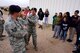 1st Lt. Christen Ornella, 90th Missile Wing Public Affairs, is shocked by a Taser during a 90th Security Forces Group demonstration for high school students from the Greeley-Evans School District 6, Colo., on F.E. Warren Air Force Base, Wyo., Sept. 10,2014. Students received an organized tour of F.E. Warren Air Force Base that highlighted the Mighty Ninety mission and showcased opportunities the Air Force may have to offer to them. (U.S. Air Force photo by Lan Kim)
