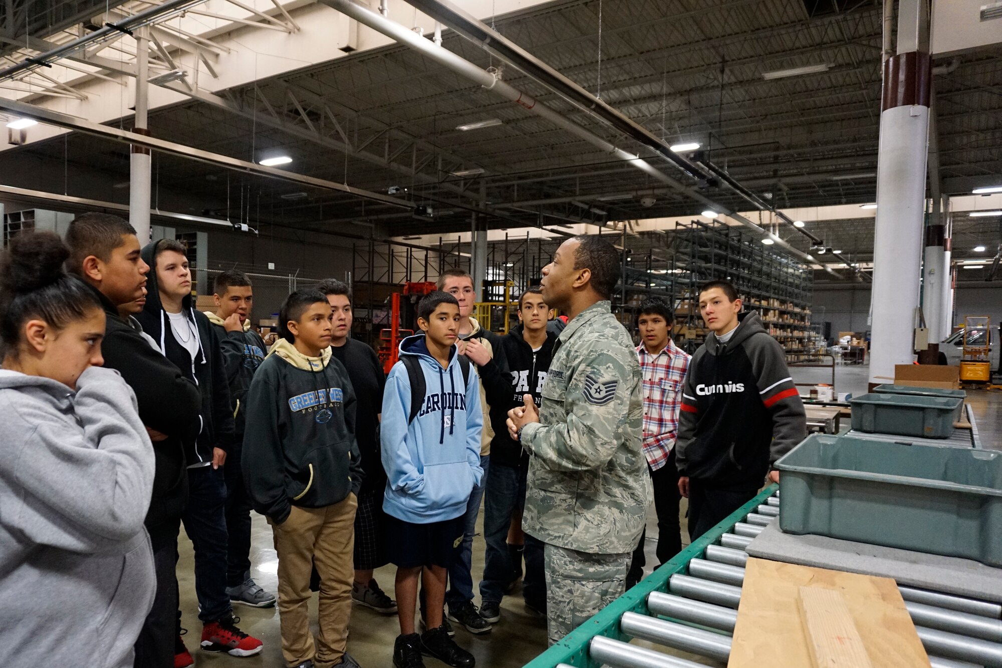 Tech Sgt. Phenice Cooper, 90th Logistics Readiness Squadron, gives a tour of a LRS warehouse on F.E. Warren Air Force Base, Wyo., Sept. 10, 2015. The students were given first-hand perspectives of what it is like to be Airmen in various career fields, including security forces, logistics and readiness, and helicopter operations. (U.S. Air Force photo by Lan Kim)
