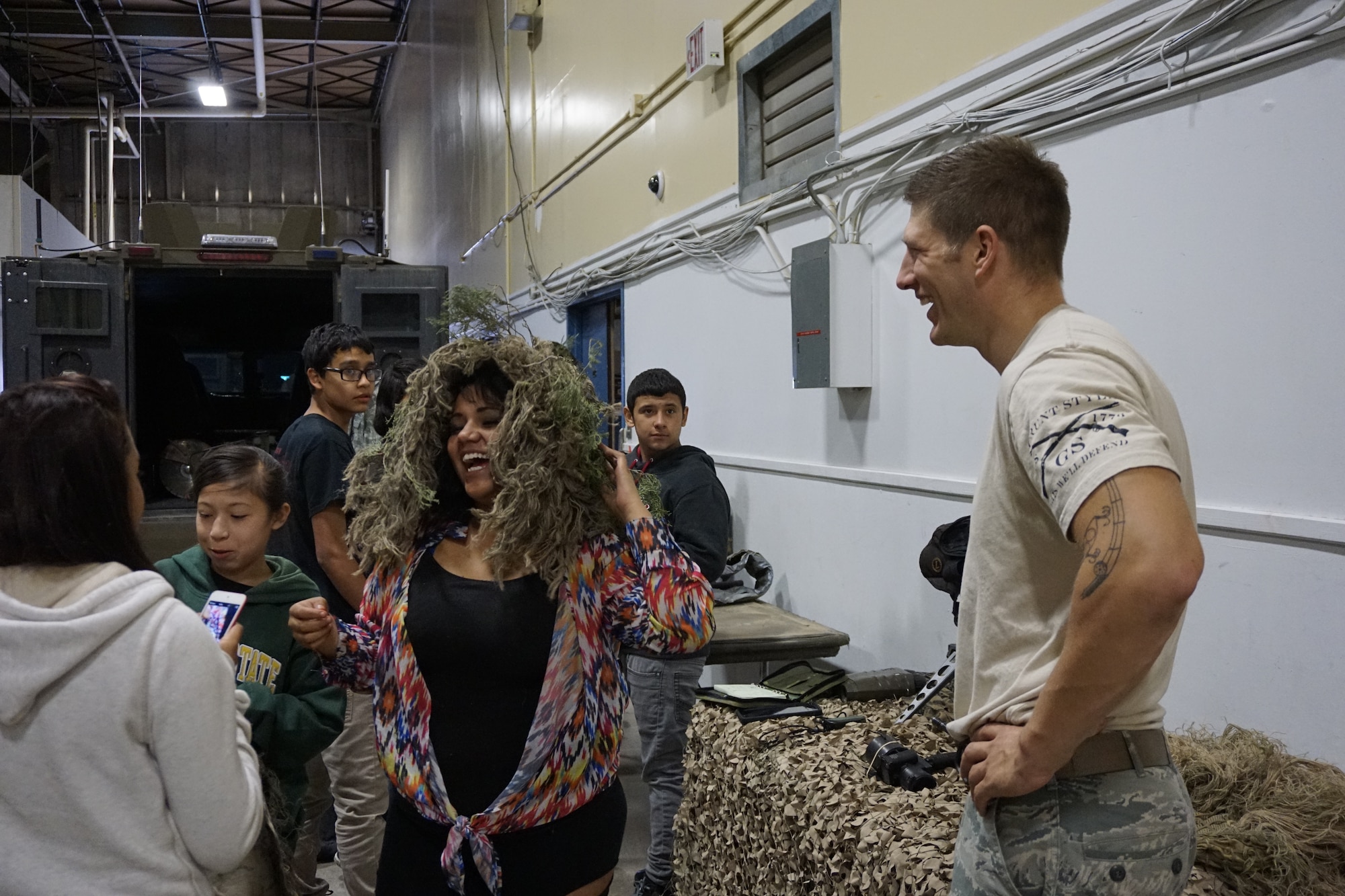 High school students from the Greeley-Evans School District 6, Colo., examine the gear used by the Tactical Response Force  Sept. 10,2014 on F.E. Warren Air Force Base, Wyo., during a tour of the base. The students were given first-hand perspectives of what it is like to be Airmen in various career fields, including security forces, logistics and readiness, and helicopter operations. (U.S. Air Force photo by Lan Kim)
