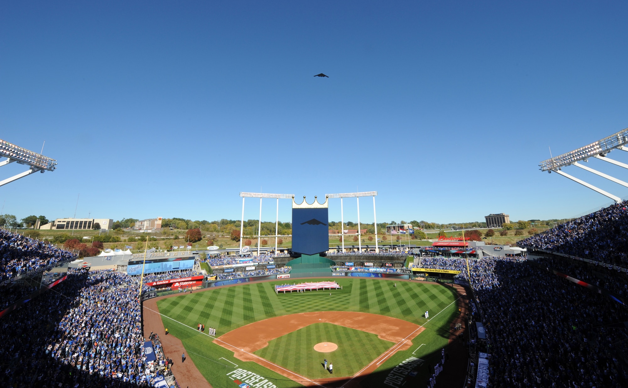 A B-2 Spirit stealth bomber from Whiteman Air Force Base, Mo., flies over the Royals vs. Orioles baseball game at Kauffman Stadium in Kansas City, Mo., Oct. 15, 2014. Airmen from the 509th Bomb Wing and 131st Bomb Wing at Whiteman performed the flag detail and represented the U.S. Air Force to a packed stadium as well as a TV viewership of millions during Game 4 of the American League Championship Series. (U.S. Air Force photo by Airman 1st Class Joel Pfiester/Released)