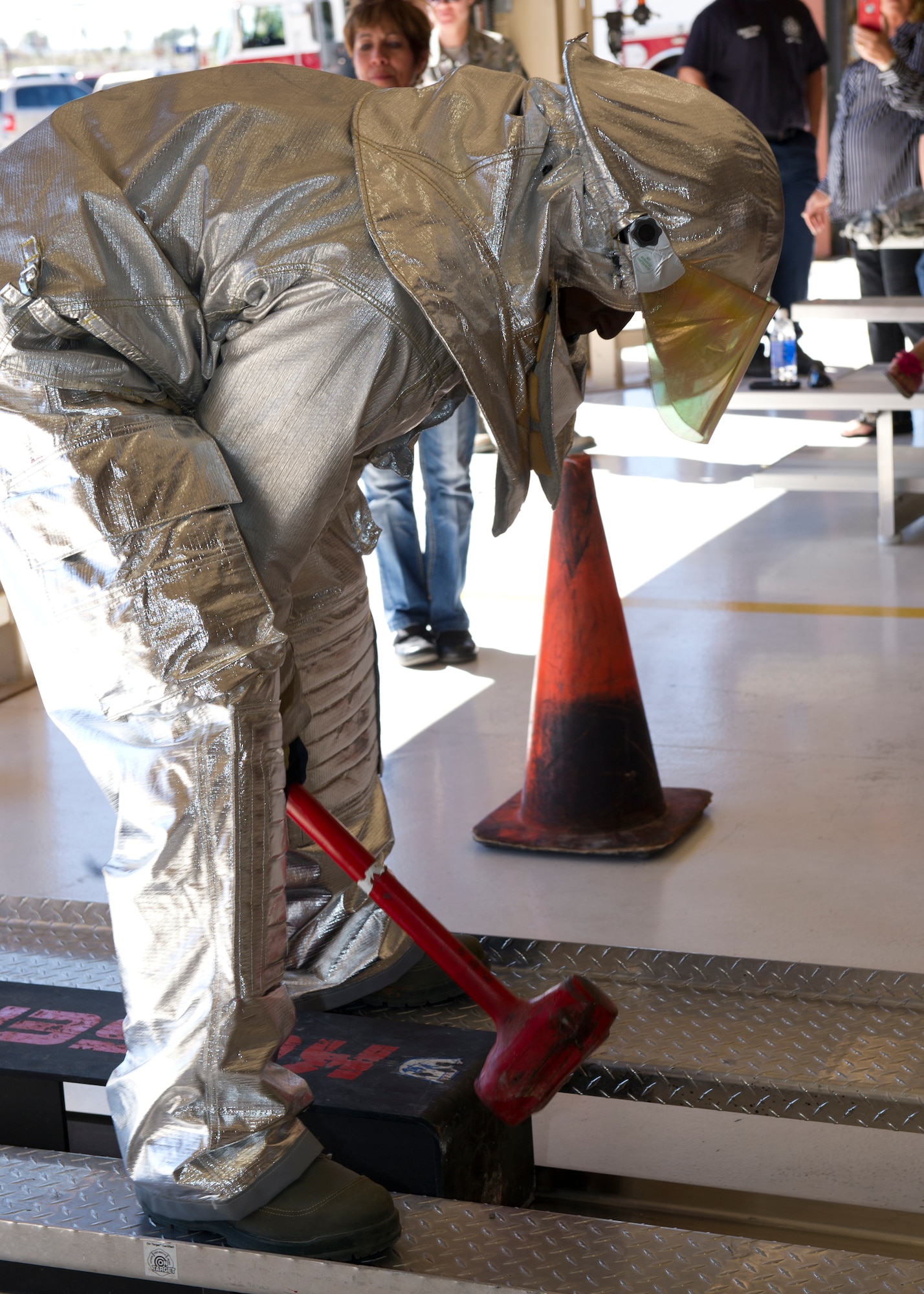 A member of the 49th Civil Engineer Squadron participates in the force sled, also known as the Kiser sled event at the 2nd Annual Fire Fighter Challenge at Holloman Air Force Base, N.M. Oct. 10. The purpose of the fire fighter challenge is to let the general public have a chance to try the everyday tasks that firefighters have to encounter. Some of the other events held at the challenge included a stair climb with a hotel pack, a 45-pound hose-roll pull, a serpentine run, a 100-foot hose pull, and a 100-foot dummy drag. (U.S. Air Force photo by Staff Sgt. E’Lysia Wray/Released)