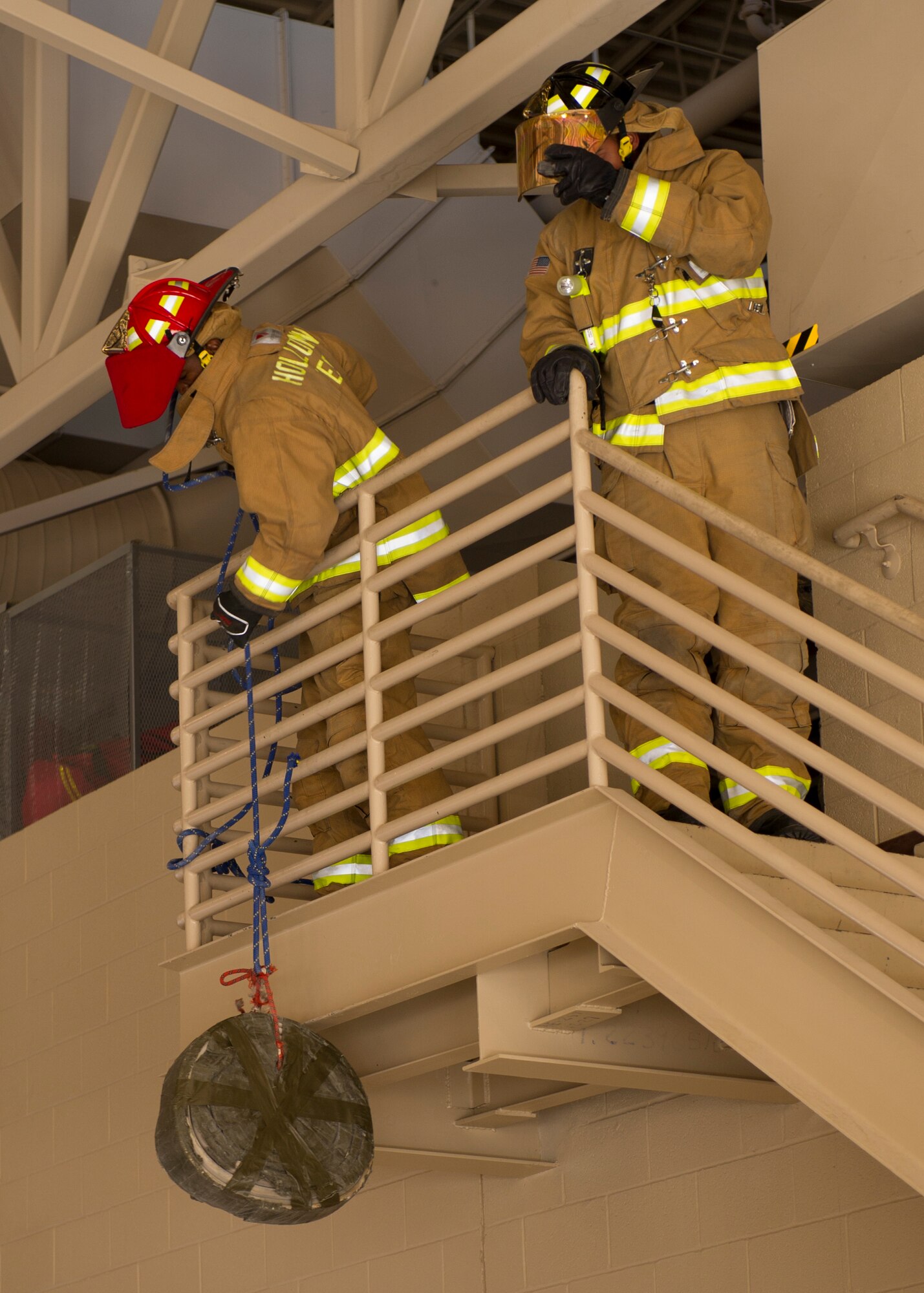 Members from Holloman Fire Emergency Services participate in the 45-pound hose roll pull event at the 2nd Annual Fire Fighter Challenge at Holloman Air Force Base, N.M. Oct. 10. Some of the other events held at the challenge included a stair climb with a hotel pack, the force sled also known as the Kiser sled, a serpentine run, a 100-foot hose pull, and a 100-foot dummy drag. The purpose of the fire fighter challenge is to let the general public have a chance to try the everyday tasks that firefighters have to encounter. (U.S. Air Force photo by Staff Sgt. E’Lysia Wray/Released)