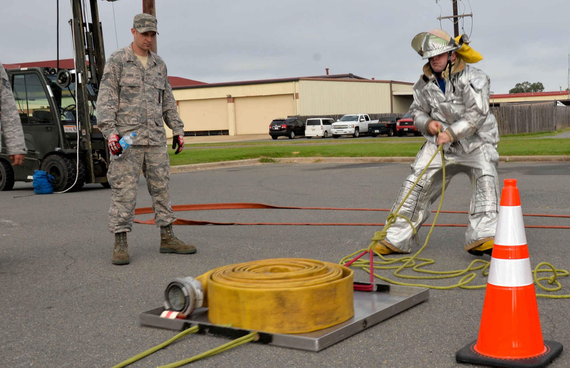 Staff Sgt. Jordan Burger, 2nd Civil Engineer Squadron Explosive Ordnance Disposal journeyman, participates in the sled-pull challenge during the 2014 fire muster on Barksdale Air Force Base, La., Oct. 9, 2014. The sled-pull is used to simulate transporting equipment up to buildings when the use of stairs is unavailable. (U.S. Air Force photo/Airman 1st Class Mozer O. Da Cunha)