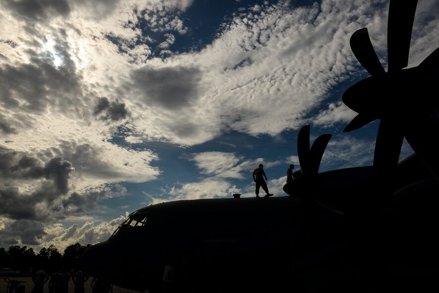 A 71st Aircraft Maintenance Unit crew chief performs a preflight inspection on an HC-130J Combat King II Oct. 8, 2014, at Avon Park Air Force Range, Fla. Maintainers prepared the aircraft for use during a WRI. (U.S. Air Force photo by Senior Airman Sandra Marrero/Released)
