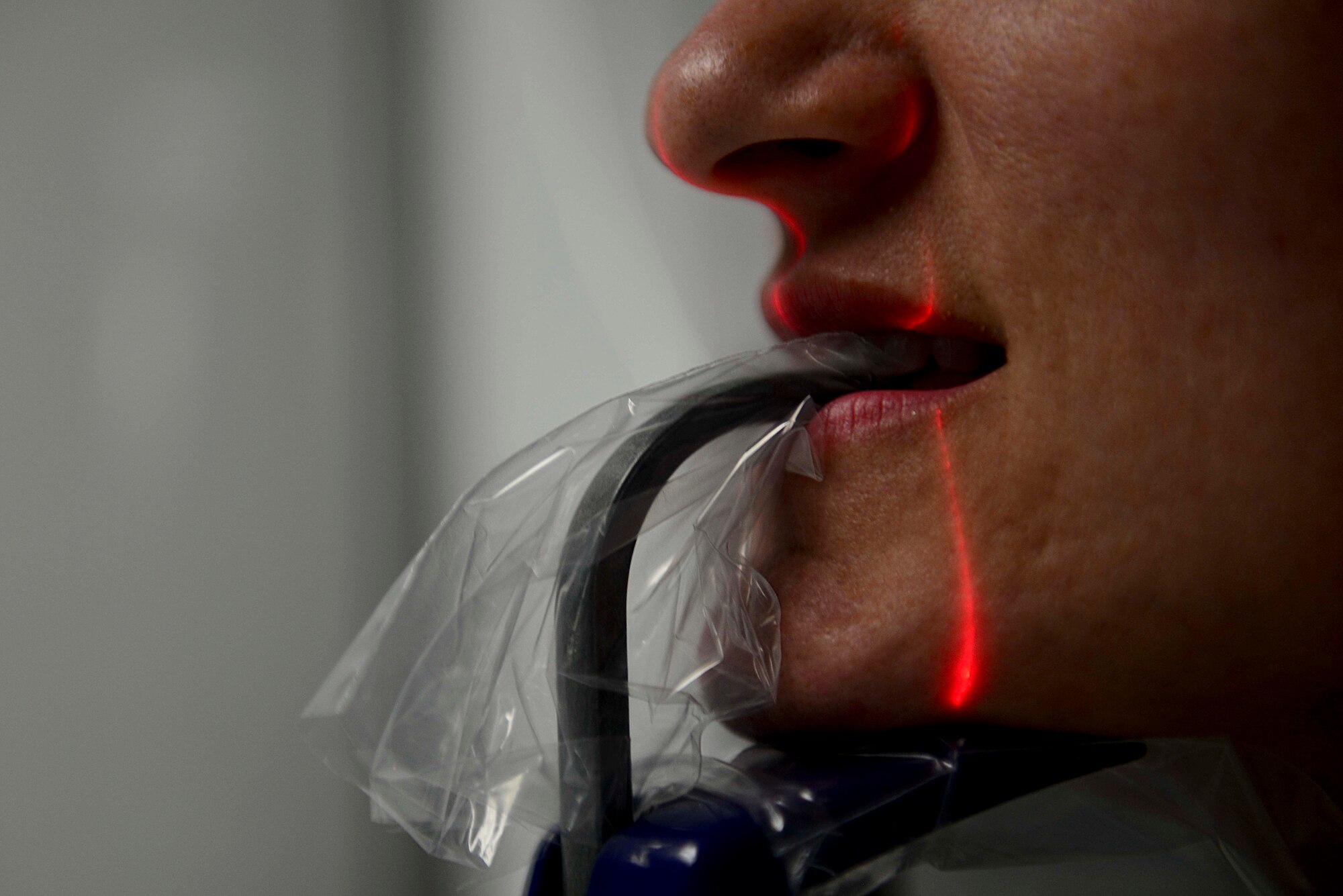 A patient at the Dental Command receives an X-ray at Fort Eustis, Va., Oct. 15, 2014. X-rays capture an image of the entire mouth to provide dentists with further details not visible to the naked eye. (U.S. Air Force photo by Airman 1st Class Kimberly Nagle/Released)