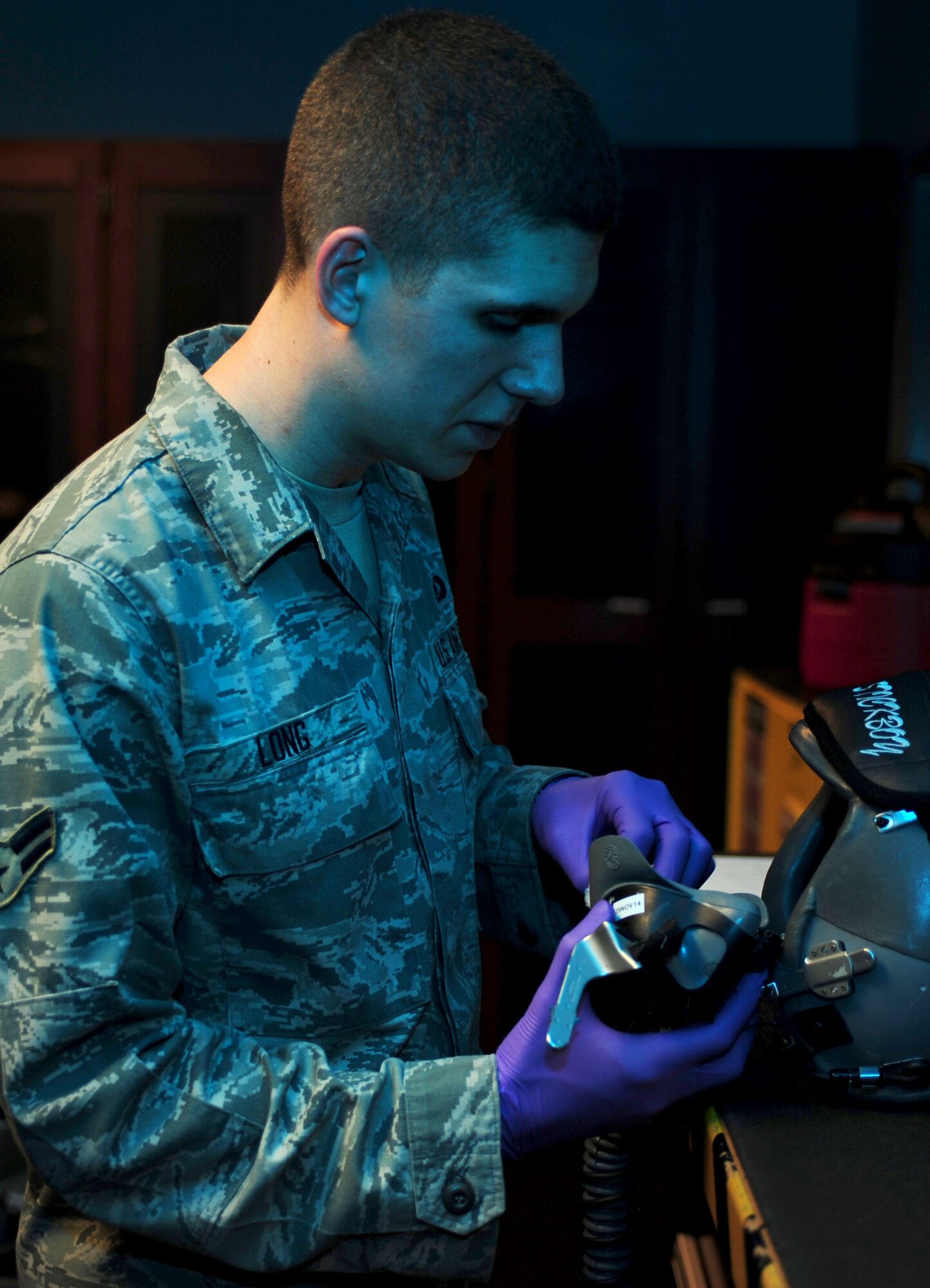 U.S. Air Force Airman 1st Class Patrick Long, 1st Operations Support Squadron aircrew flight equipment apprentice, conducts post flight inspections at Langley Air Force Base, Va., Oct. 15, 2014. In addition to performing safety checks, AFE Airmen ensure aircrew members are prepared to deploy and understand the purpose, operation, care and use of their equipment. (U.S. Air Force photo by Airman 1st Class Areca T. Wilson/Released) 