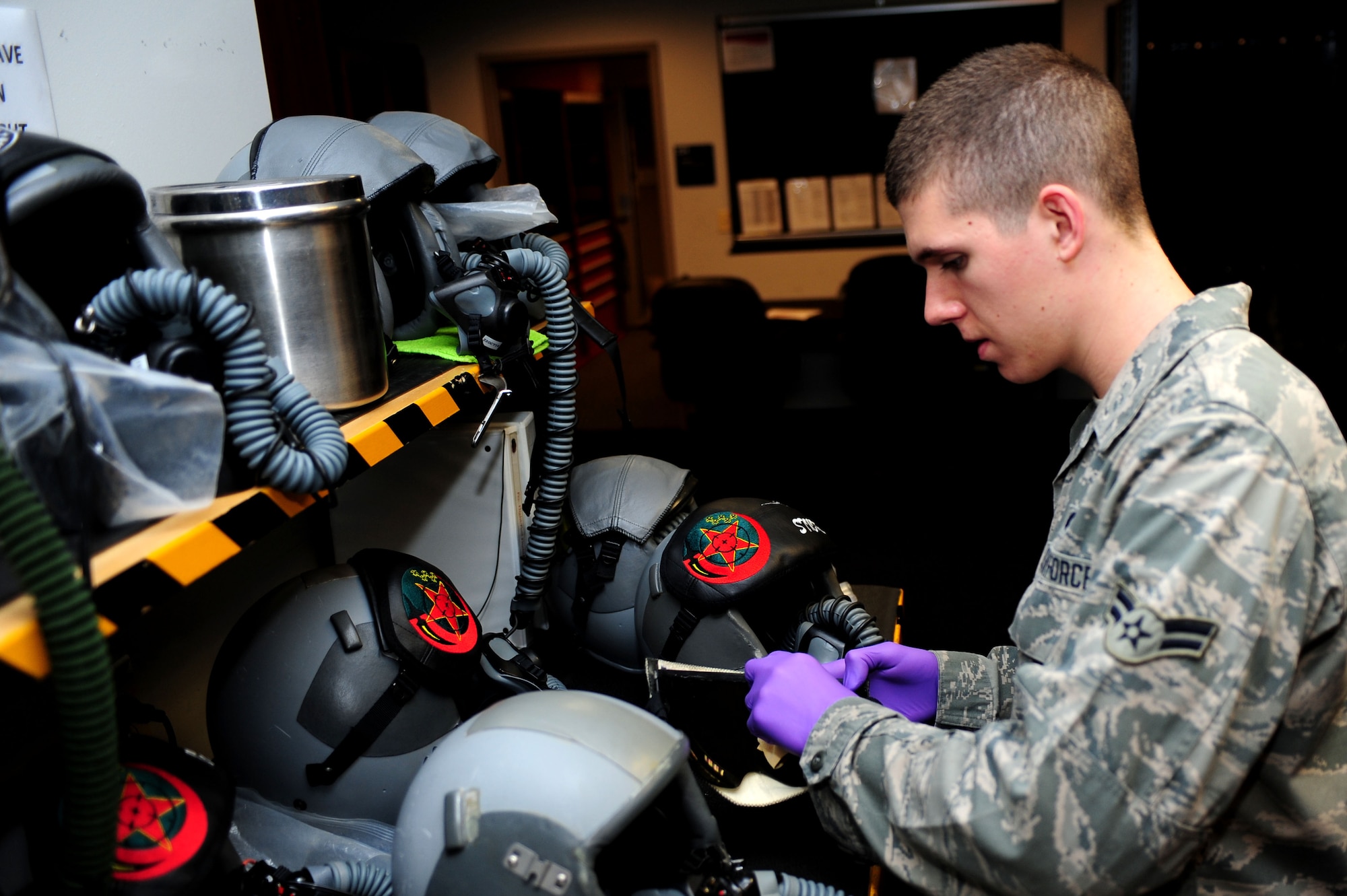 U.S. Air Force Airman 1st Class Patrick Long, 1st Operations Support Squadron aircrew flight equipment apprentice, conducts post flight inspections at Langley Air Force Base, Va., Oct. 15, 2014. AFE Airmen perform operator maintenance and service inspections on various pieces of equipment including helmets, survival kit and night vision goggles. (U.S. Air Force photo by Airman 1st Class Areca T. Wilson/Released) 