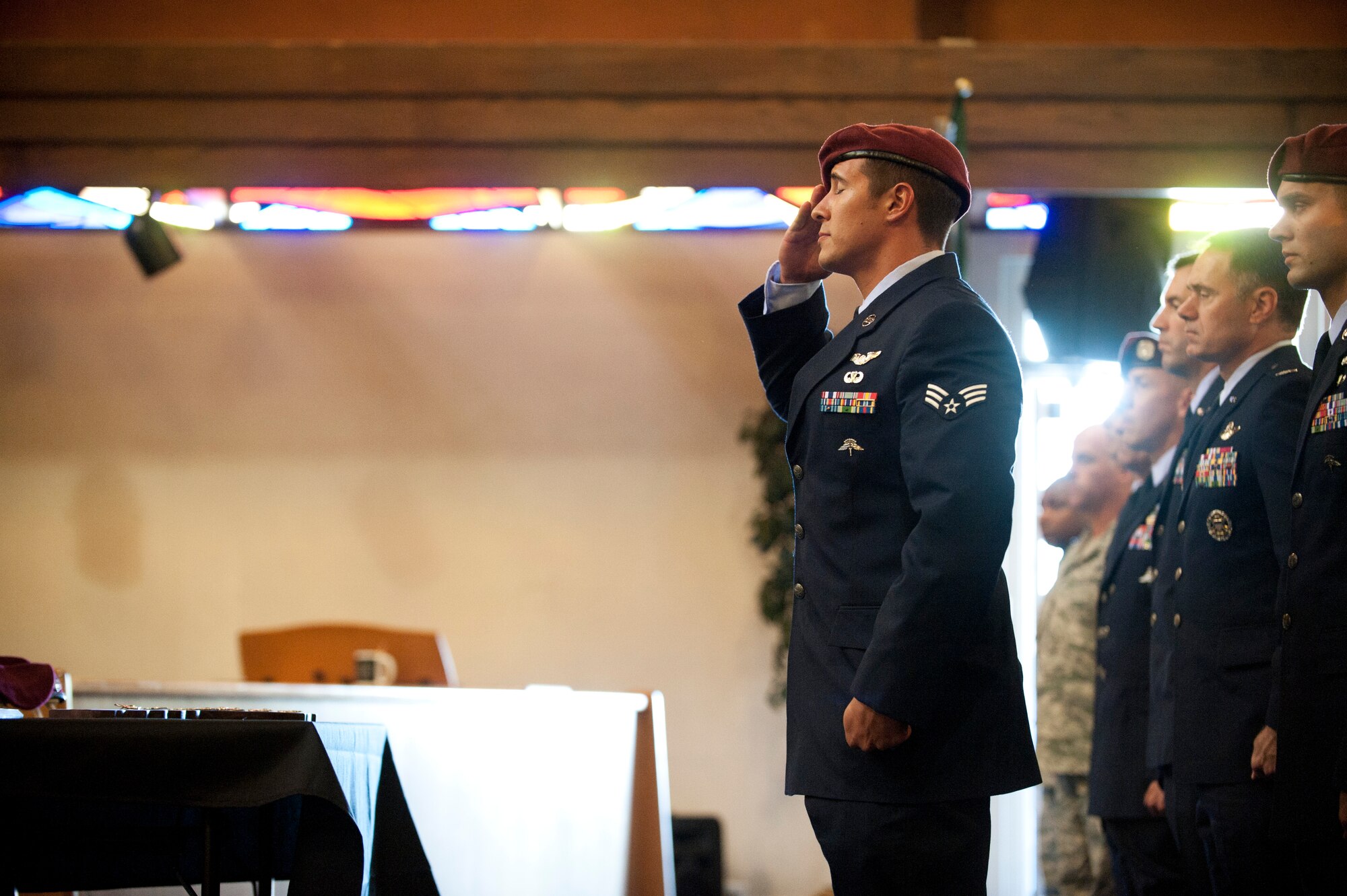 A pararescueman from the 58th Rescue Squadron renders a salute at the memorial ceremony for fellow pararescueman Staff Sgt. Benjamin Roberts at the base Chapel on Nellis Air Force Base, Nev., Oct. 10, 2014. Roberts was killed in a motor-vehicle accident in Las Vegas on Oct. 3, 2014. (U.S. Air Force photo by Airman 1st Class Thomas Spangler)