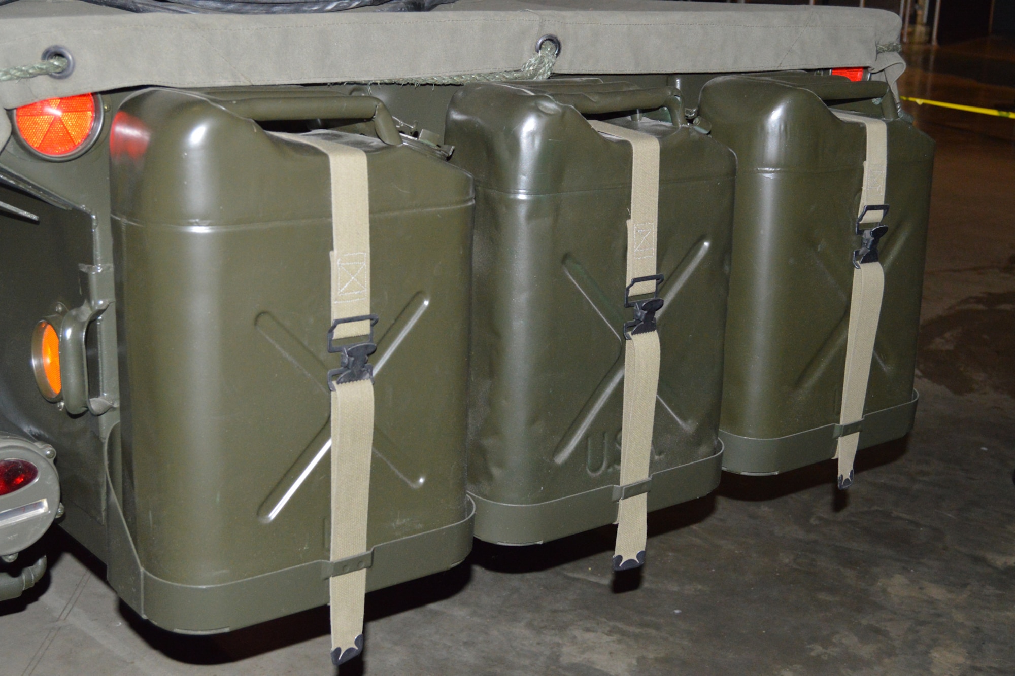 DAYTON, Ohio -- Gasoline cans for the AN/MRC-108 Communication System on display in the Southeast Asia War Gallery at the National Museum of the U.S. Air Force. (U.S. Air Force photo) 
