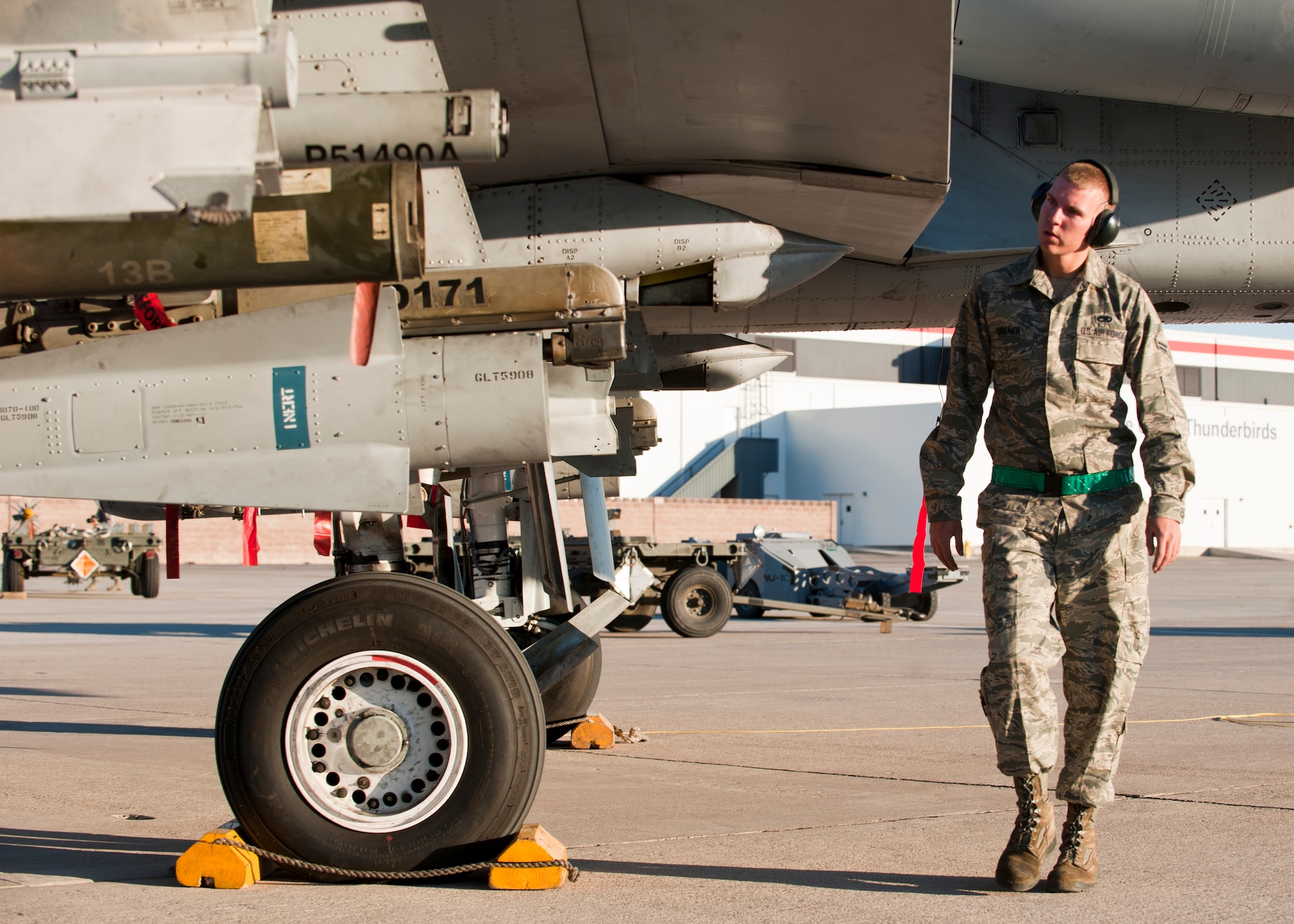Airman 1st Class Jacob Varner, 757th Aircraft Maintenance Squadron Thunder Aircraft Maintenance Unit weapons loader, checks over inert weapons that have been loaded onto an A-10 Thunderbolt II during a quarterly weapons load crew competition at Nellis Air Force Base, Nev., Oct. 10, 2014. While recognizing superior performers, load crew competitions also help keep weapons loaders’ skills sharp and ready for real-world situations. (U.S. Air Force photo by Airman 1st Class Thomas Spangler)