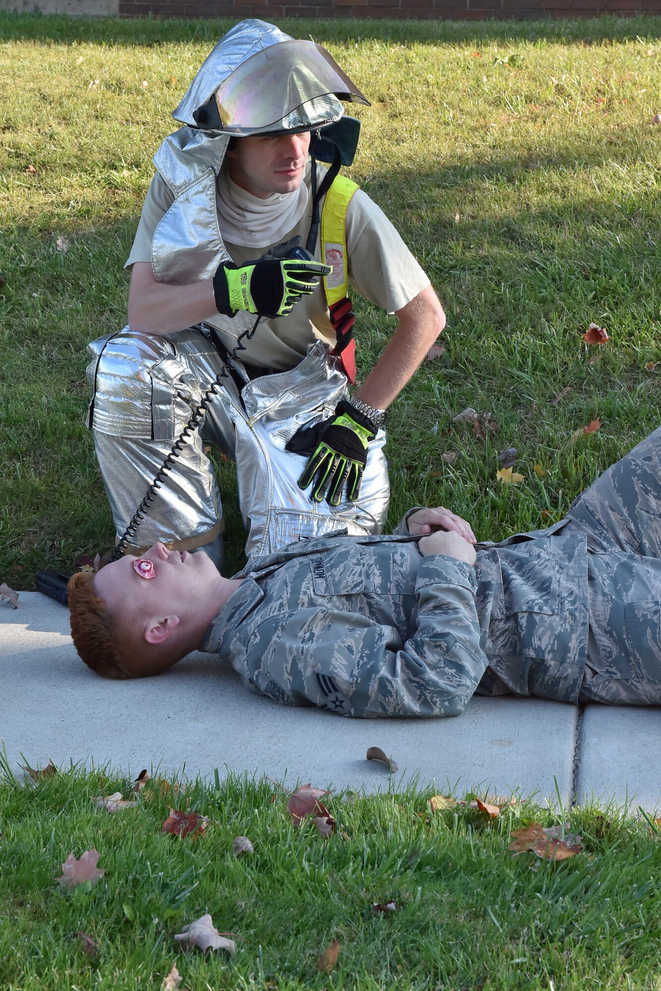 Tech. Sgt. Tim Wertz, a 910th Civil Engineer Fire Department firefighter, calls in injury reports during a natural disaster response exercise here, Oct. 5, 2014. The exercise, which occurred during the Oct. Unit Training Assembly (UTA), was intended to hone emergency reaction and response skills for base personnel. U.S. Air Force photo/Tech. Sgt. Jim Brock.