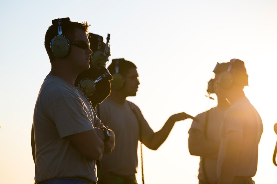 Aircraft maintainers from the 41st Helicopter Maintenance Unit standby prior to a takeoff Oct. 9, 2014, at Avon Park Air Force Range, Fla. Rescue helicopters are constantly on alert while in deployed locations and maintainers standby to get the aircraft in the sky. (U.S. Air Force Photo by Airman 1st Class Ryan Callaghan/Released)