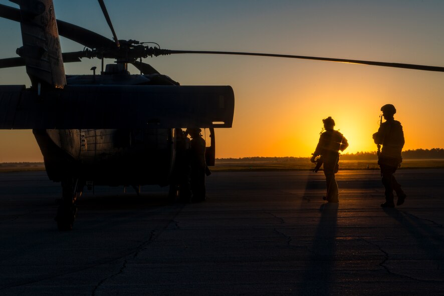 Pararescuemen from the 38th Rescue Squadron walk toward an HH-60G Pave Hawk Oct. 9, 2014, at Avon Park Air Force Range, Fla. PJs are trained in emergency medical tactics as well as combat and survival skills so they can rescue their fellow Airmen in any scenario. (U.S. Air Force Photo by Airman 1st Class Ryan Callaghan/Released)