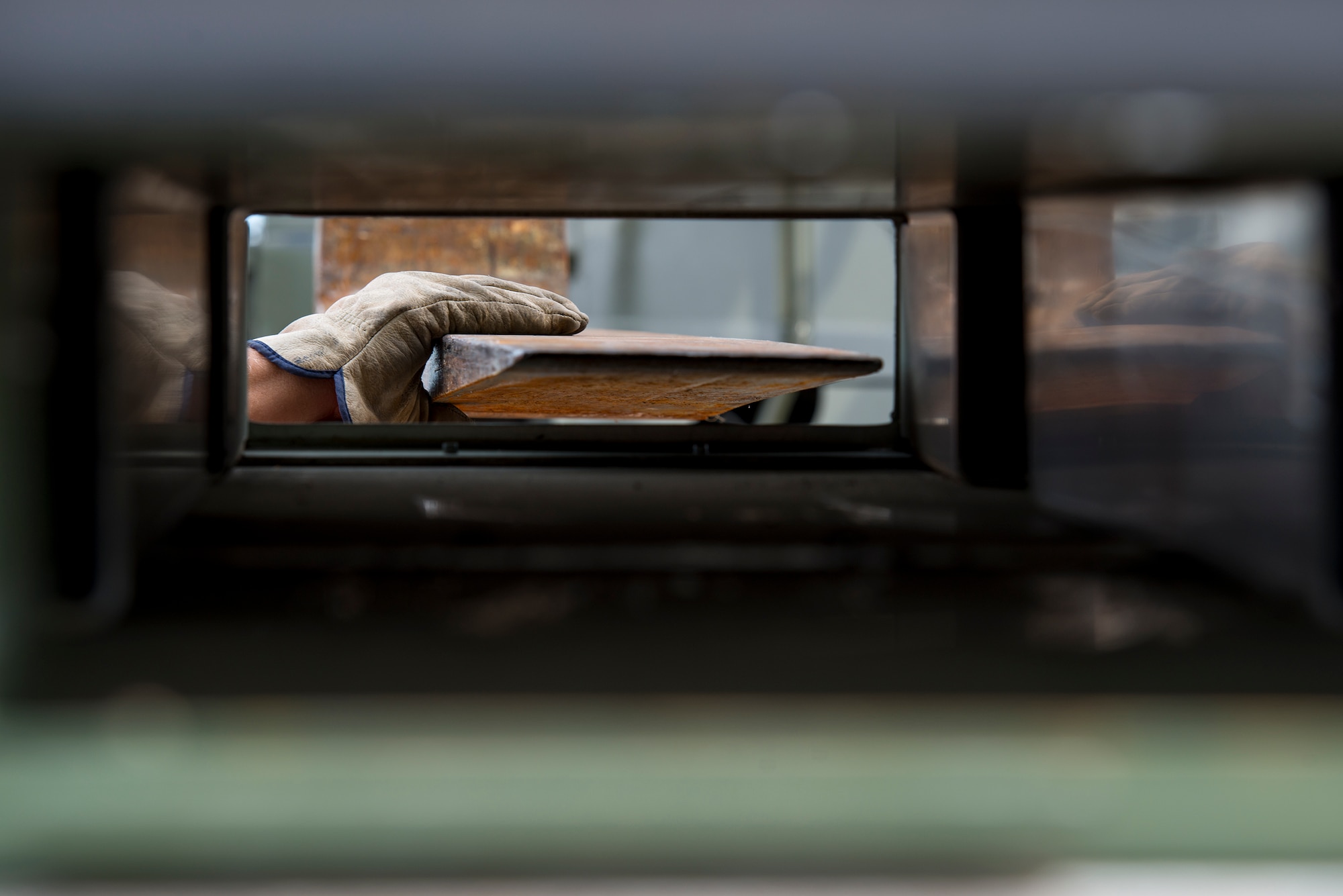 An Airman guides a forklift into the bottom of a container Oct. 7, 2014, at Avon Park Air Force Range, Fla. Deploying units pack their equipment into connex boxes, metal shipping containers built on top of pallets, for processing and shipping to their deployed location. (U.S. Air Force Photo by Airman 1st Class Ryan Callaghan/Released)