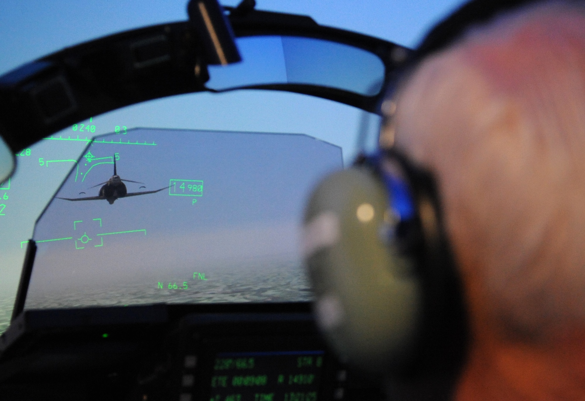 Retired Lt. Col. Robert Pardo approaches an F-4 Phantom while in the F-15E Strike Eagle flight simulator at Seymour Johnson Air Force Base, North Carolina, Oct. 10, 2014. While attempting to recreate his “Pardo’s Push” maneuver he told those watching he “didn’t know how anyone could do something like that” and that it must take “a lot of guts.” (U.S. Air Force photo/Airman 1st Class Ashley J. Thum)
