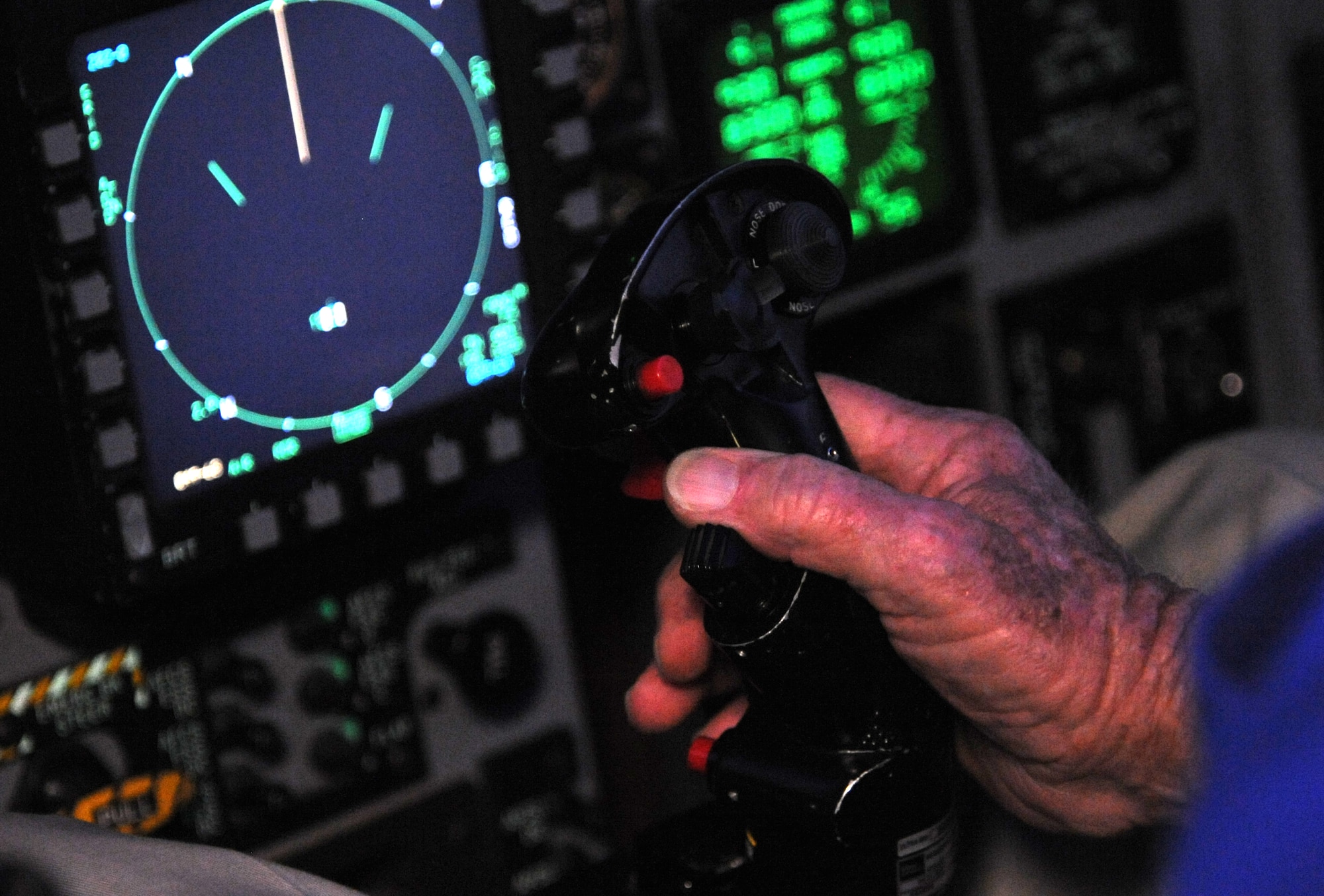 Retired Lt. Col. Robert Pardo manipulates the controls of the F-15E Strike Eagle simulator at Seymour Johnson Air Force Base, North Carolina, Oct. 10, 2014. Pardo spent 20 years in the Air Force and went on to fly commercial aircraft after his retirement in 1974. (U.S. Air Force photo/Airman 1st Class Ashley J. Thum)
