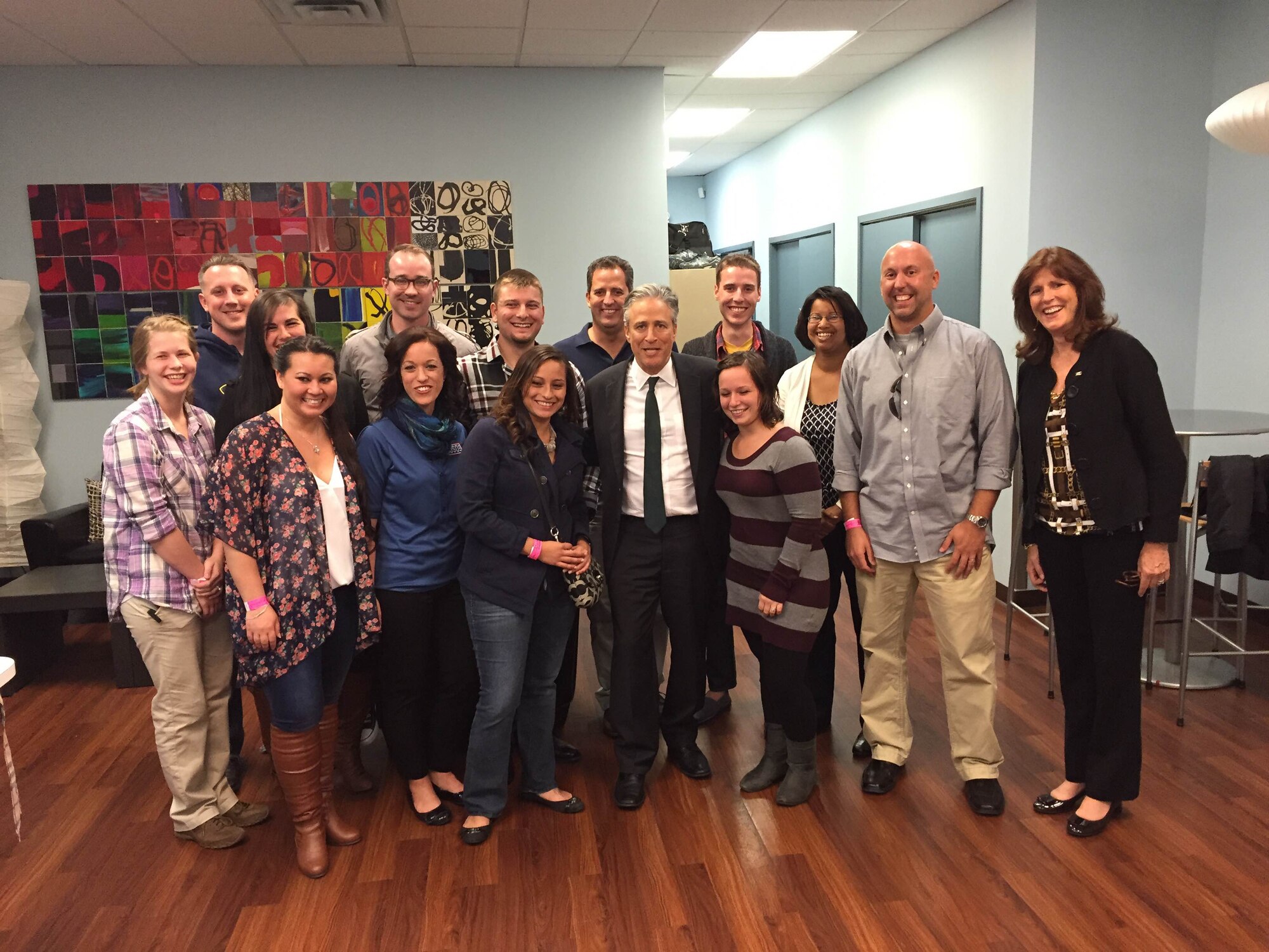 Team Dover Airmen and USO officials pose with Jon Stewart, after a recording of “the Daily Show with Jon Stewart,” Oct. 9, 2014, in New York, N.Y. The Airmen were in New York for a four-day all inclusive trip provided by the USO. (U.S. Air Force photo/Airman 1st Class Zachary Cacicia)