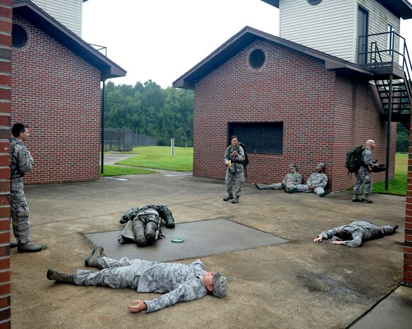 Members of the 1st Combat Camera Squadron participate in a sensitive site exploitation exercise Sept. 26, 2014, on Joint Base Charleston, S.C. The purpose of the exercise was to train Airmen to capture critical imagery in austere conditions. (U.S. Air Force photo/Staff Sgt. Sean Martin)