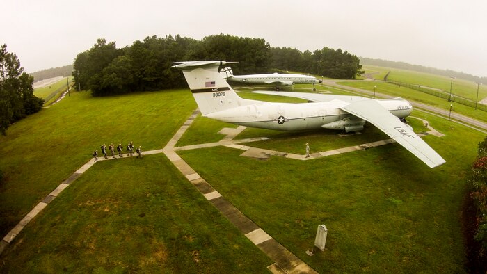 An aerial photo taken with an unmanned quad copter documents members of the 1st Combat Camera Squadron participating in a ruck march Sept. 26, 2014, on Joint Base Charleston, S.C. The purpose of the ruck march was to train Airmen to capture critical imagery in austere conditions. (U.S. Air Force photo/Senior Airman Nicholas Byers)