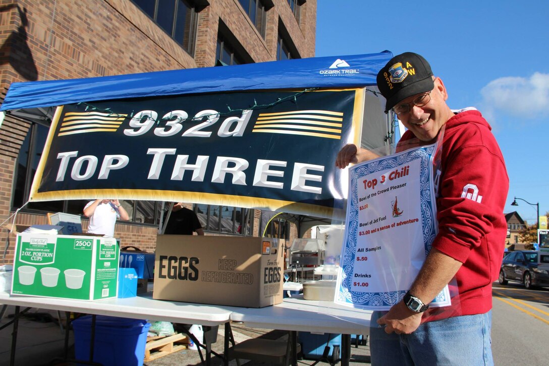 Master Sgt. Gerald Sonnenberg, 932nd wing historian, was one of many enthusiastic Top Three organization volunteers who helped run the special food production booth in Belleville's chili cookoff competition.  The organization raised over $700 to help with wing support and Airman's programs.  (U.S. Air Force photo/Maj. Stan Paregien)