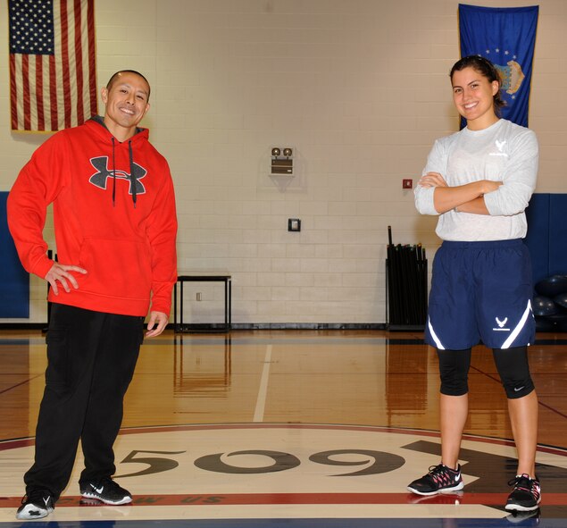 U.S. Air Force Tech. Sgt. Christopher Iseri, left, 509th Maintenance Squadron and 2nd Lt. Elisabeth Mellado, 509th Force Support Squadron, pose after competing in the Iron Airmen Challenge at Whiteman Air Force Base, Mo., Oct. 10, 2014. Iseri scored a 393 out of 400 and Mellado scored a 389. (U.S. Air Force photo by Airman 1st Class Joel Pfiester /Released)