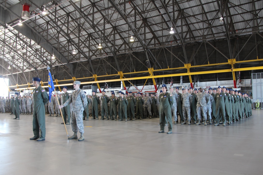 Standing by...members of the 932nd Operations Group, 932nd Airlift Wing, under command of Lt. Col. Sean Pierce, stand at the ready during a recent change of command event inside the hangar.  The OG is responsible for the flying mission for the reserve unit near Belleville, Ill.  (U.S. Air Force photo/Maj. Stan Paregien)