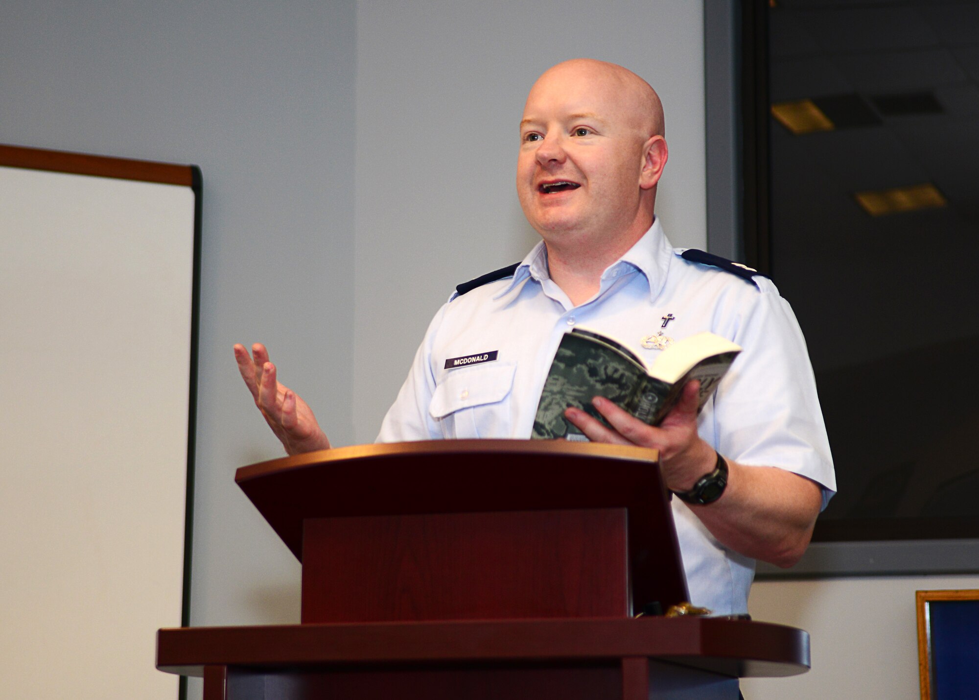 U.S. Air Force Chaplain (Capt.) Michael McDonald, 633rd Air Base Wing chaplain, speaks during a dormitory bible study at Langley Air Force Base, Va., Sept. 30, 2014. The bible study takes place in the First Term Airman Center every Tuesday at 6 p.m. The Single Airmen Ministry is a social and spiritual outlet for Airmen living in the dormitories, unmarried Airmen and Airmen with deployed spouses. (U.S. Air Force photo by Airman 1st Class Devin Scott Michaels/Released)