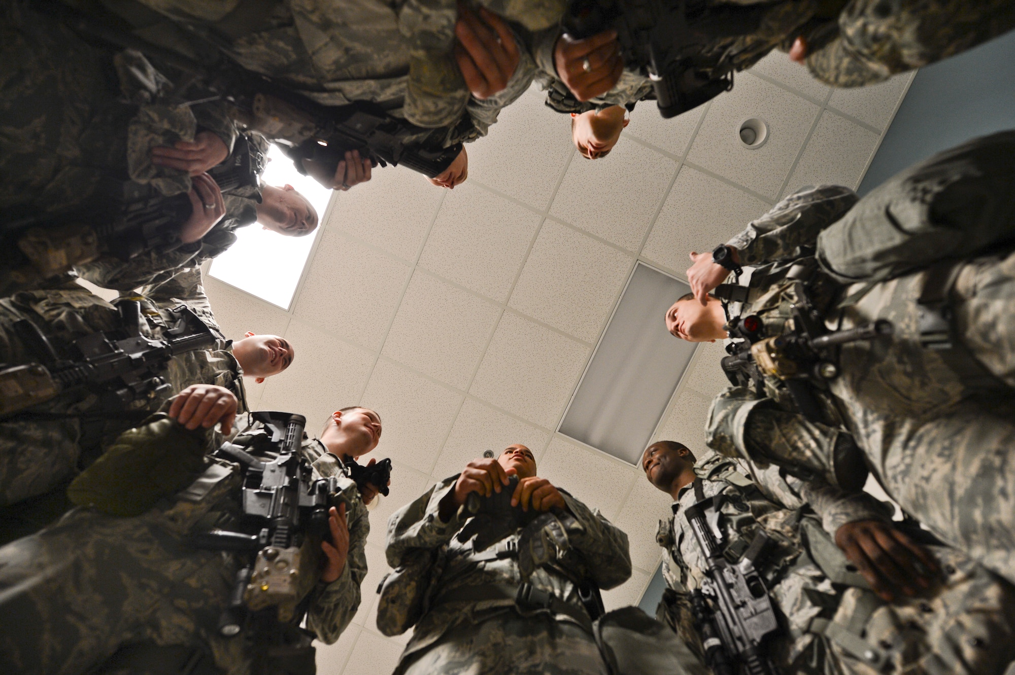 Members of the 20th Security Forces Squadron converse before starting the Defenders Edge Challenge at Shaw Air Force Base, S.C., Oct. 8, 2014. Four-Airmen teams raced against the clock through 10 obstacles to complete as accurately as possible. (U.S. Air Force photo by Senior Airman Tabatha Zarrella/Released)