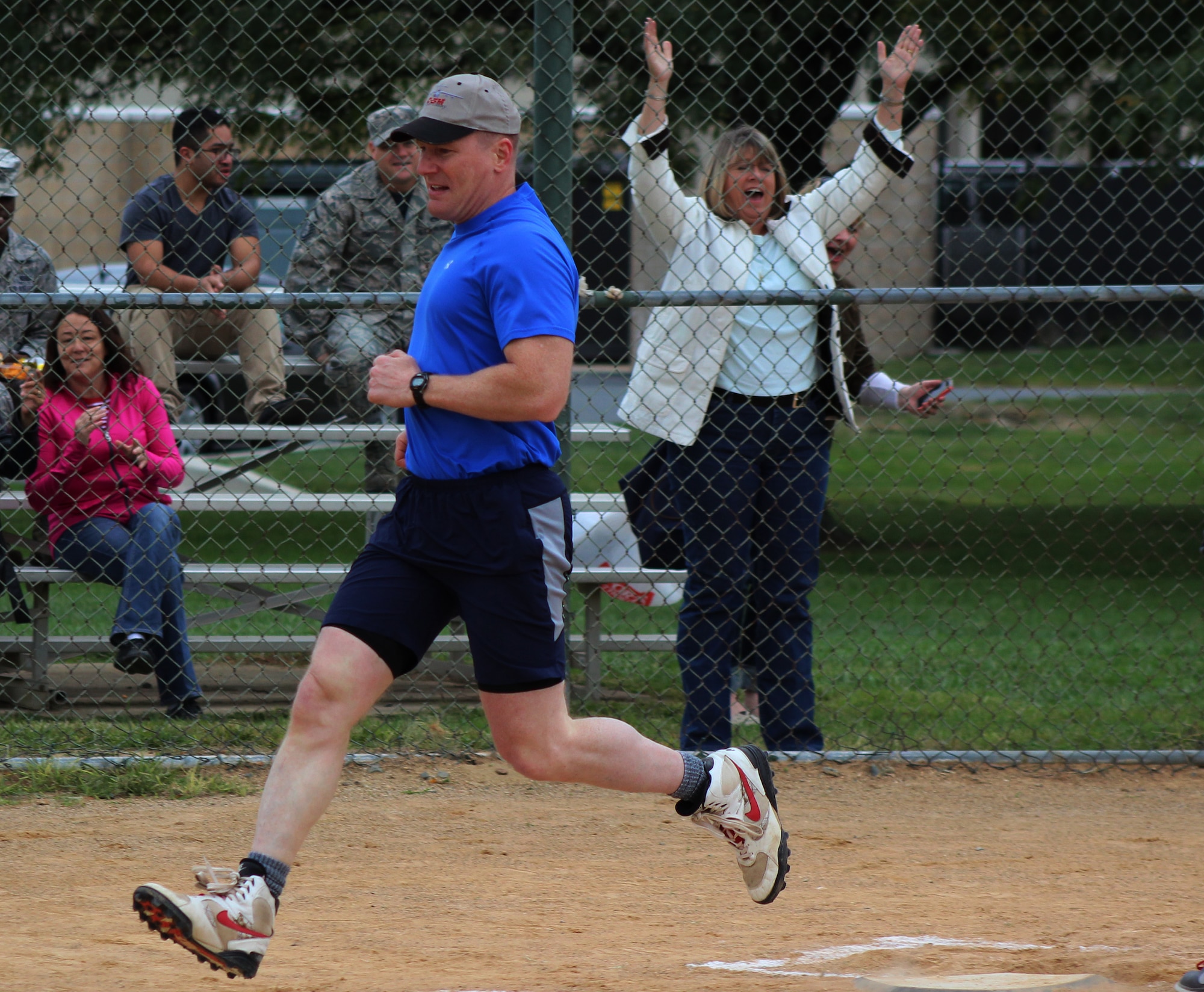 Col. Michael Grismer, 436th Airlift Wing commander, scores a run during the Eagles versus Chiefs softball game Oct. 10, 2014, at Dover Air Force Base, Del. The Eagles fielded a roster of Team Dover colonels, while the Chiefs fielded Team Dover chief master sergeants and selected enlisted members. (U.S. Air Force photo/Herbert E. Welday III)
