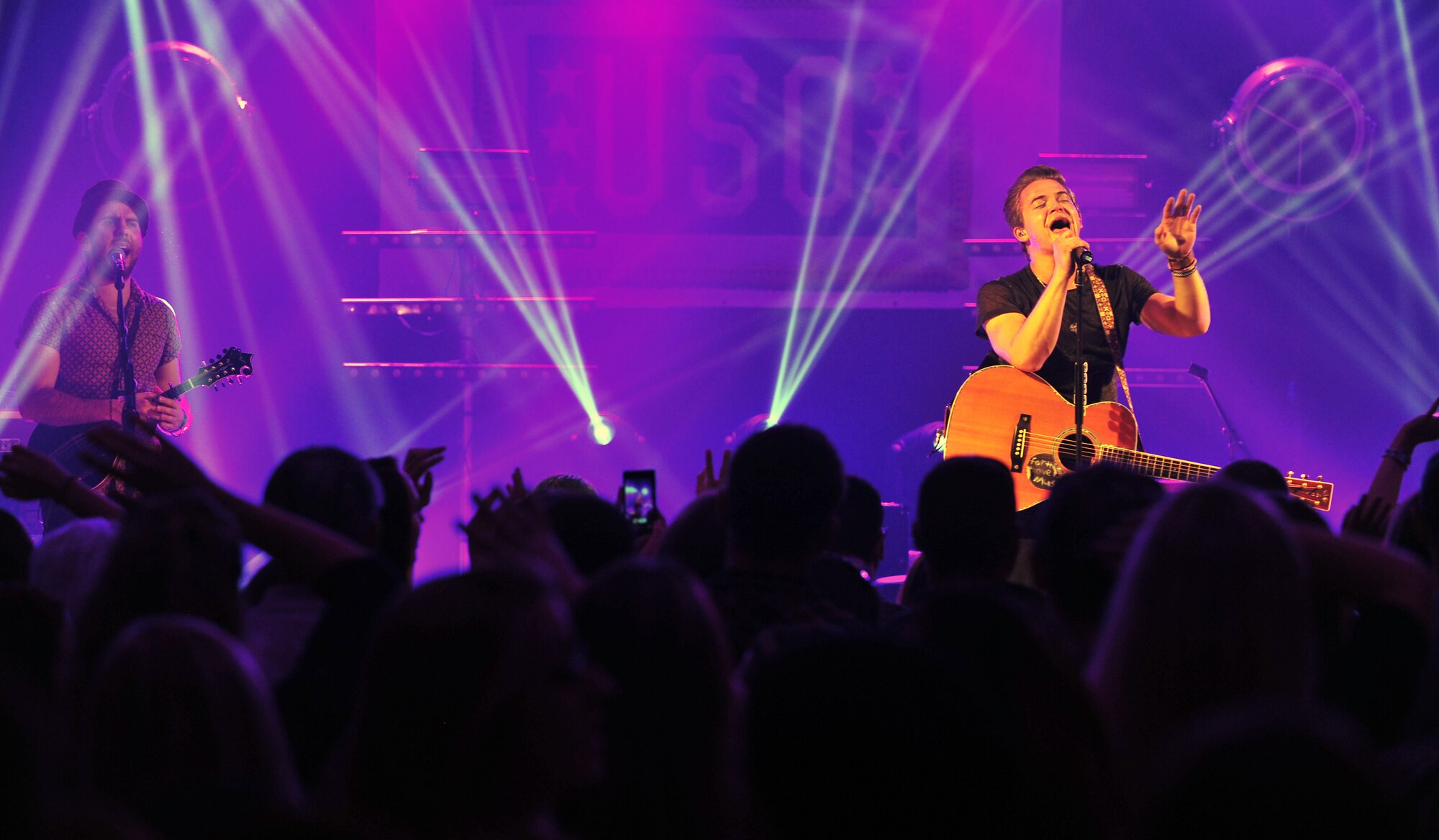 Hunter Hayes, a country music singer, performs for Team Mildenhall and RAF Lakenheath members as part of a United Services Organization concert Oct. 11, 2014, on RAF Mildenhall, England. This was Hayes’ first USO concert. (U.S. Air Force photo/Senior Airman Christine Griffiths/Released)