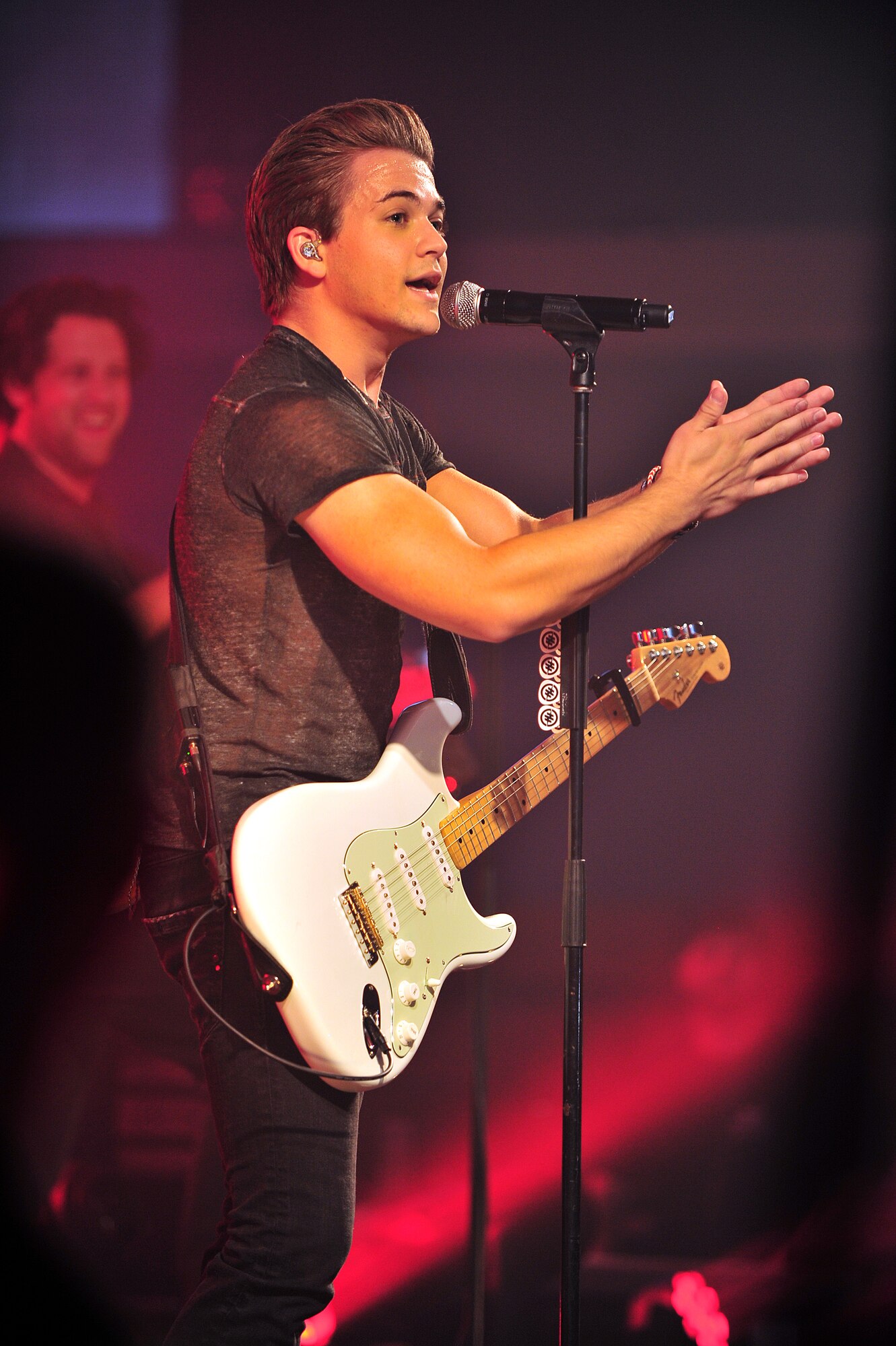Hunter Hayes, a country music singer, gives time to thank all military members during a United Services Organization concert Oct. 11, 2014, on RAF Mildenhall, England. This was Hayes’ first USO concert. (U.S. Air Force photo/Senior Airman Christine Griffiths/Released)